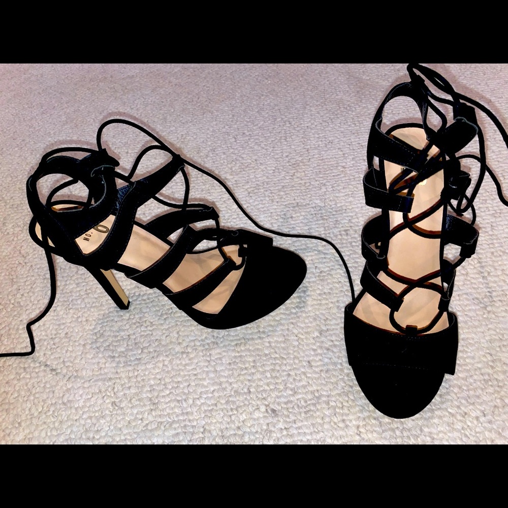 Size 10. Worn once: Sexy, strappy, lace-up black heels for your holiday parties